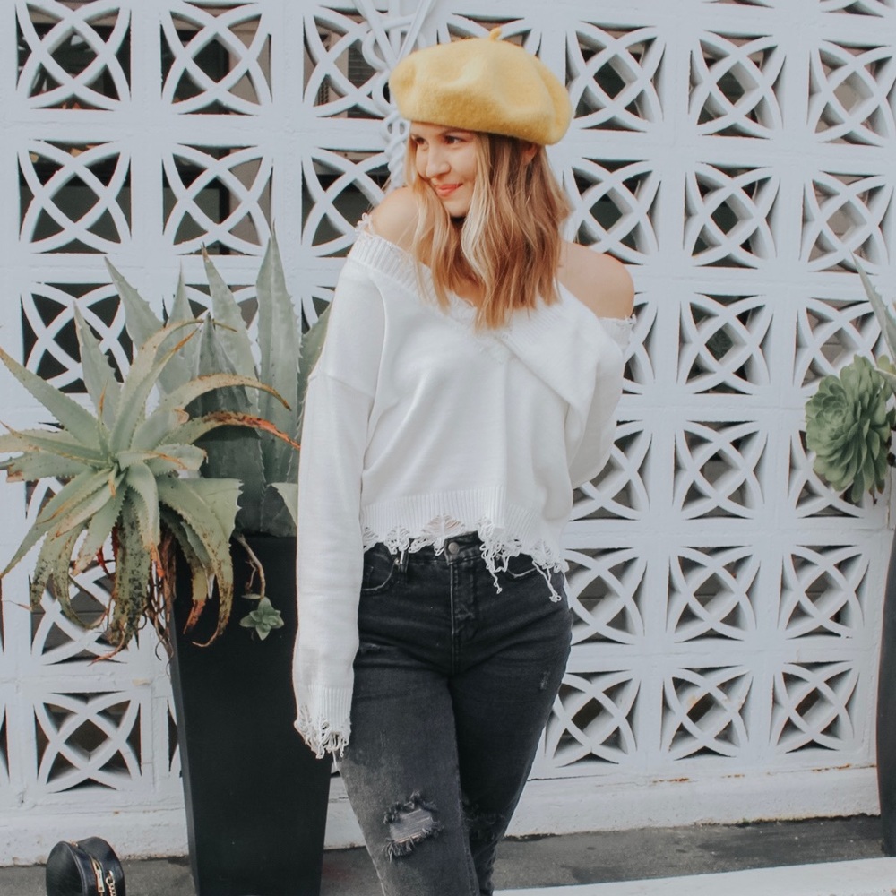 White ripped sweater